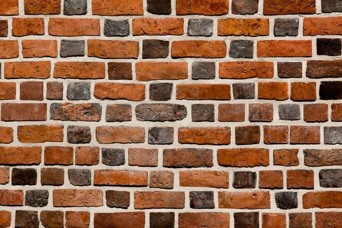 800px-Brick_wall_close-up_view Fysieke winkel